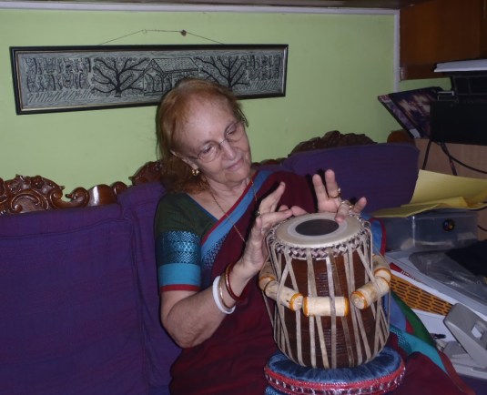 Dr. Harrison playing with the new tabla, getting lost in the sound.