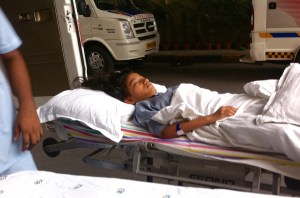 On the stretcher about to go into the ambulance between MRI and EEG.